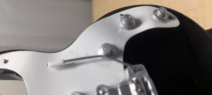 Фотография покупателя товара Гитара сувенирная Ibanez, на подставке, 24×8×2 см, чёрно-белая - Фото 2