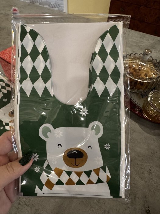 Фотография покупателя товара Пакет подарочный новогодний, полиэтиленовый с ушками «Дед Мороз в очках», МИКС, 13×23 см - Фото 1