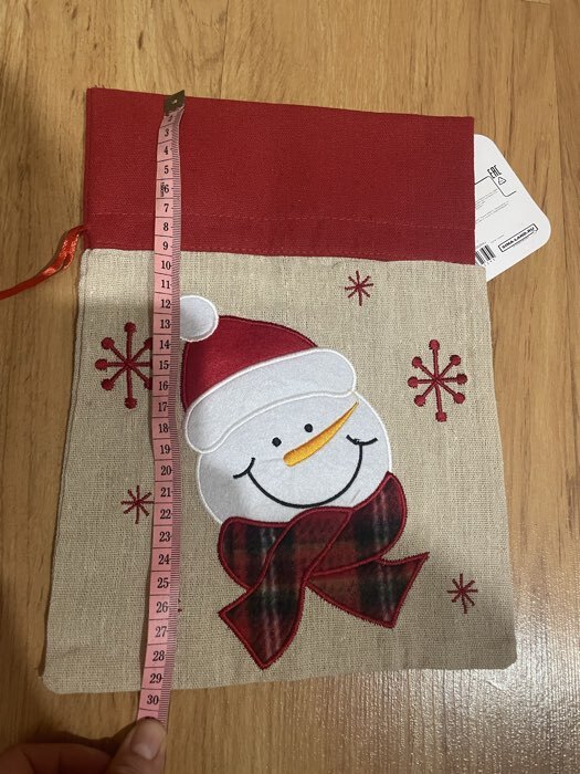 Фотография покупателя товара Мешок новогодний для подарков «Дед Мороз и снежинки», на завязках, 29×22 см - Фото 2