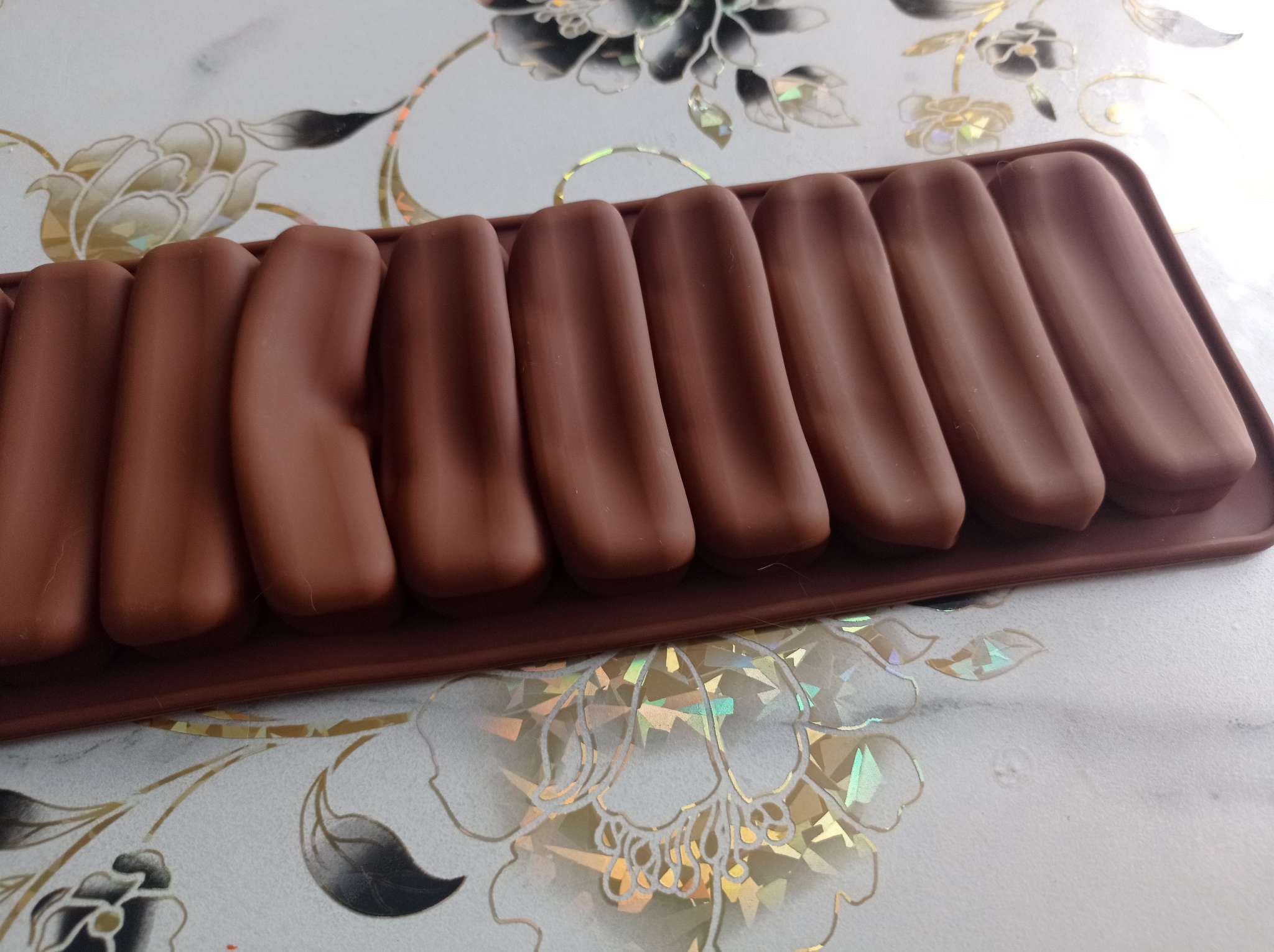 Фотография покупателя товара Форма для выпечки печенья Доляна «Савоярди», силикон, 26×9 см, 10 ячеек (7.1×1.7 см), коричневая - Фото 11