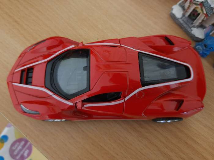 Фотография покупателя товара Машинка металлическая «Купе», 1:28, световые и звуковые эффекты, открываются двери, цвет красный - Фото 4