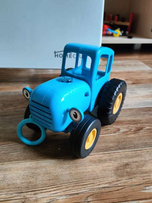 Фотография покупателя товара Каталка музыкальная «Синий трактор» с палкой