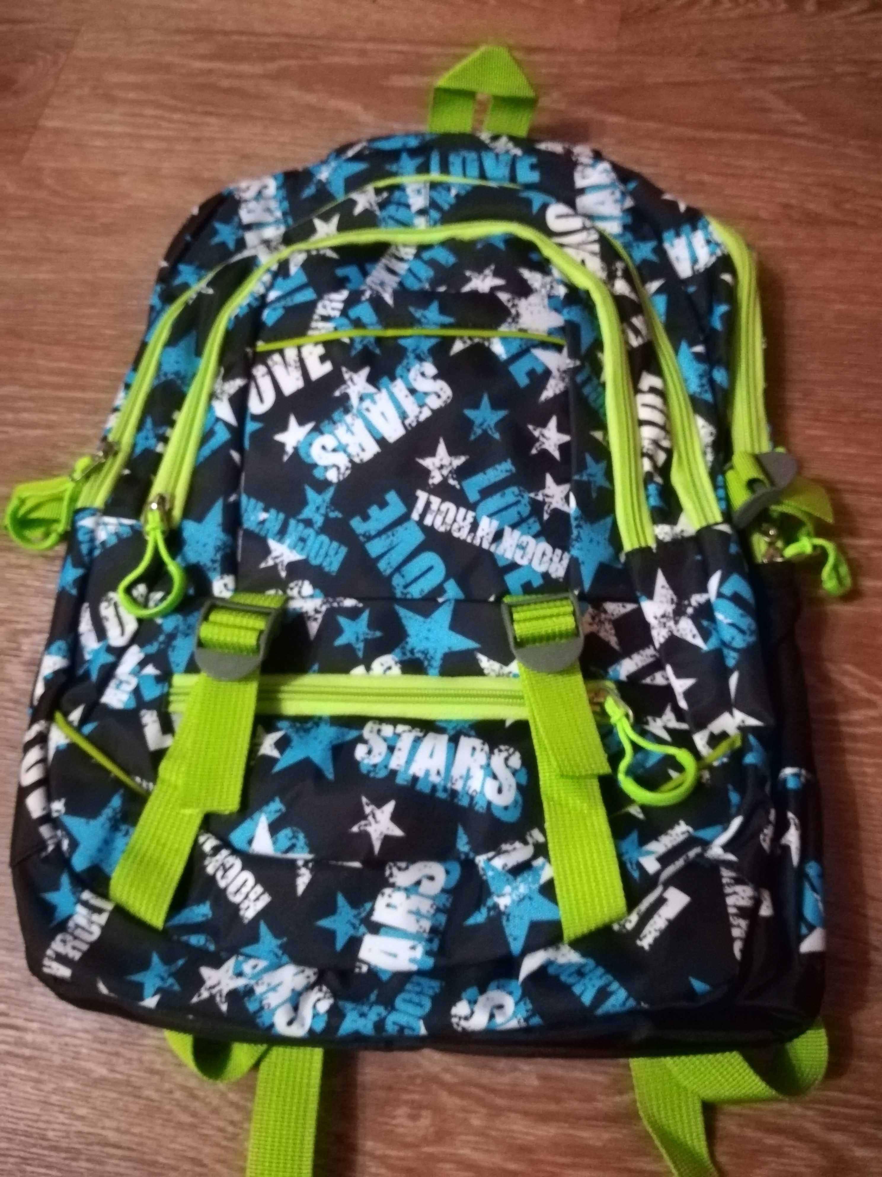 Фотография покупателя товара Рюкзак школьный, отдел на молнии, 3 наружных кармана, 2 боковые сетки, цвет чёрный/разноцветный