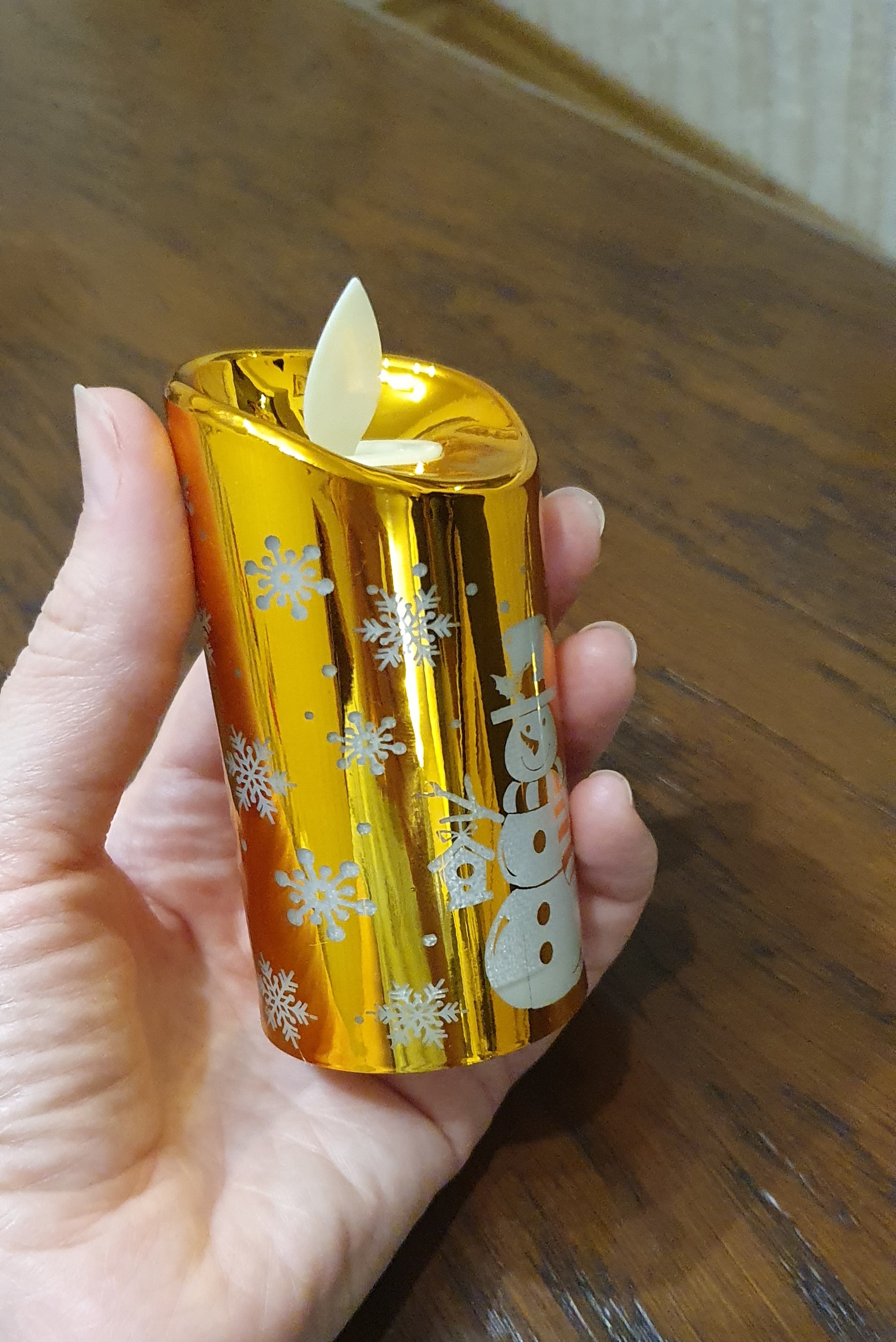 Фотография покупателя товара Светодиодная фигура «Золотистая свеча со снеговиком» 5 × 9 × 5 см, пластик, батарейки AG13х3, свечение тёплое белое - Фото 1