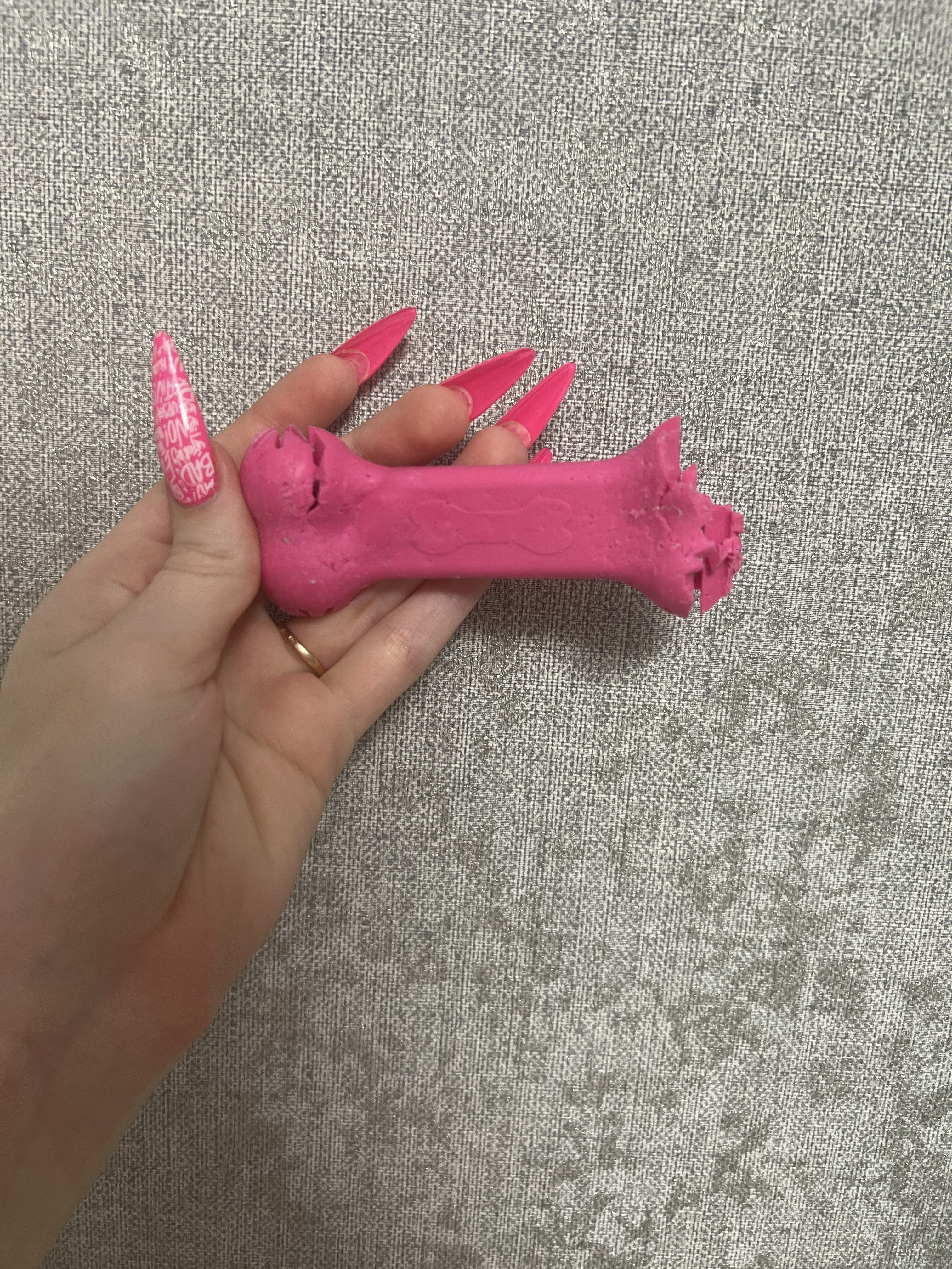 Фотография покупателя товара Игрушка жевательная "Вкусная кость" с отверстиями для лакомств, TPR, 11 см, розовая