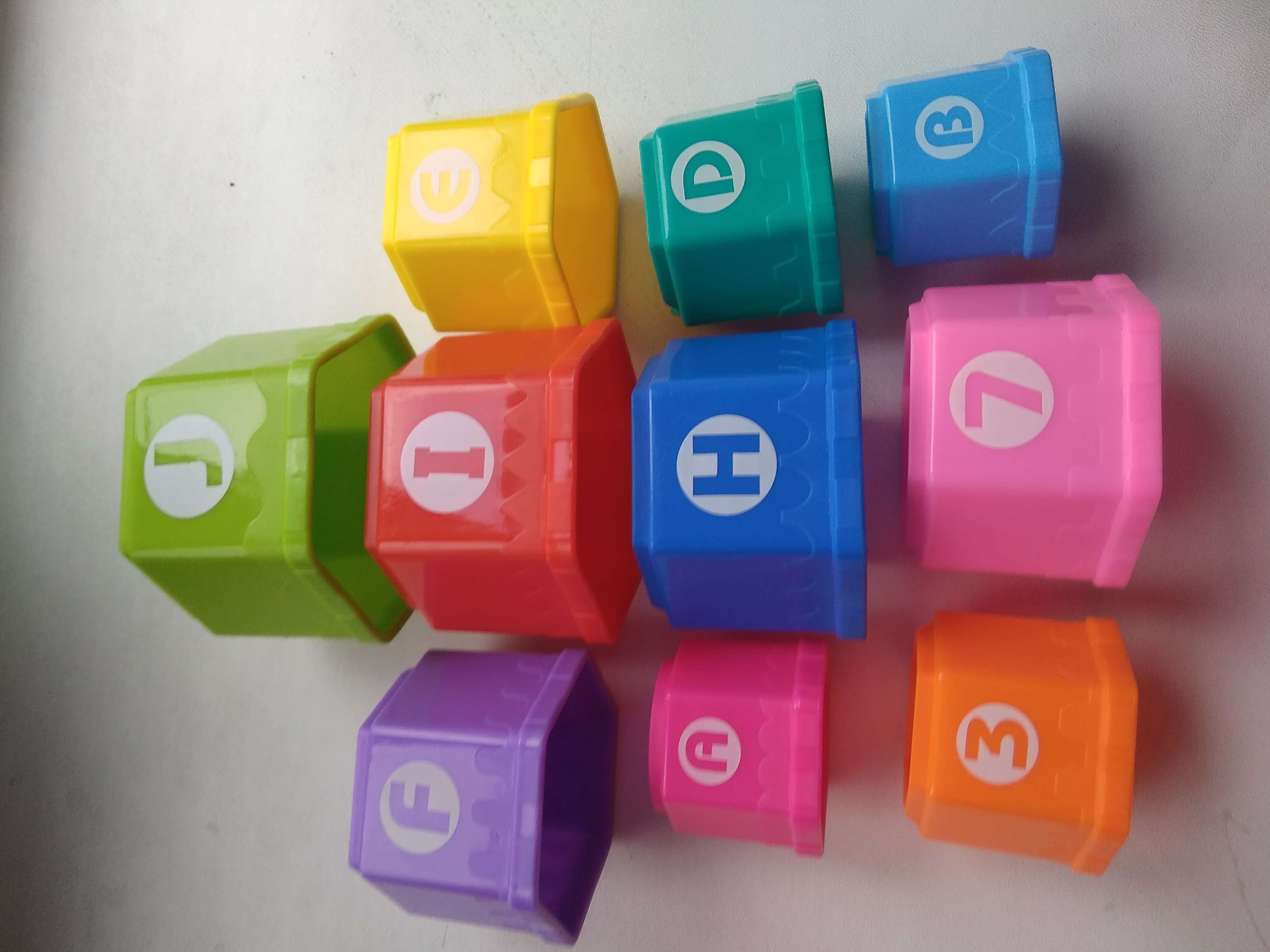 Фотография покупателя товара Развивающая игрушка «Пирамидка: Мишка», стаканчики с буквами и цифрами, 11 предметов - Фото 4