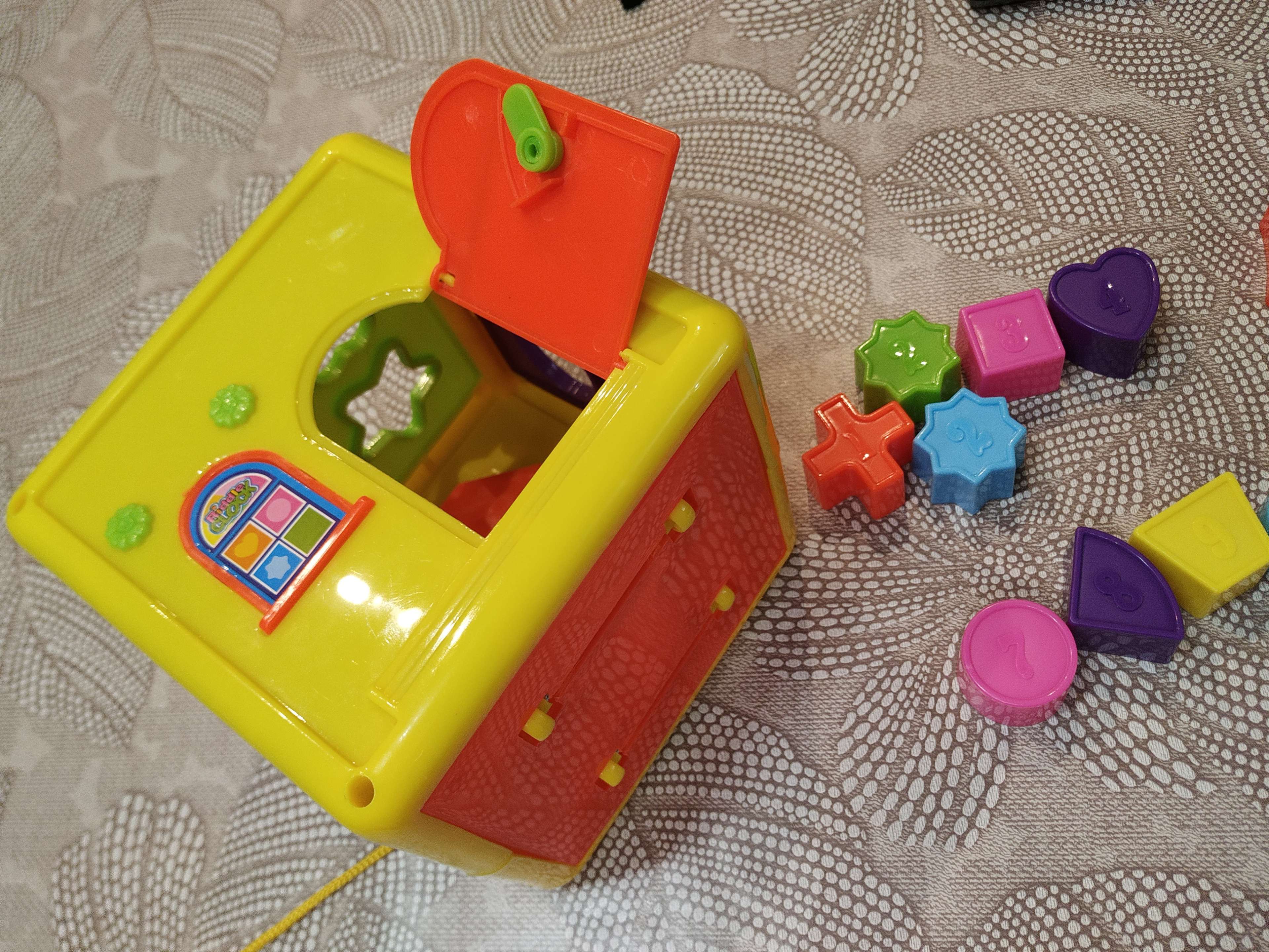 Фотография покупателя товара Развивающая игрушка сортер-каталка «Домик», цвета МИКС - Фото 6