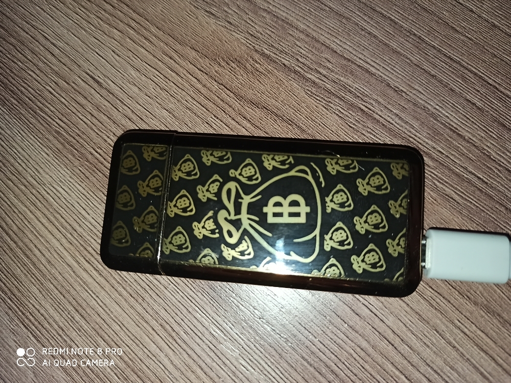 Фотография покупателя товара Зажигалка электронная "Биткоин", спираль, USB, 3.5 х 7 см, черно-золотая - Фото 1