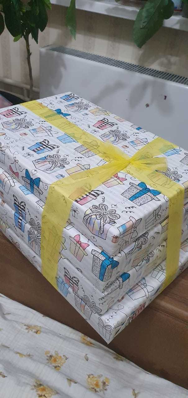 Фотография покупателя товара Бумага упаковочная глянцевая «Подарочки», 70 х 100 см - Фото 2