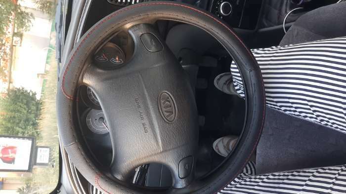 Фотография покупателя товара Оплетка на руль TORSO, кожа PU, перфорация, размер 38 см, красная строчка, черный - Фото 3