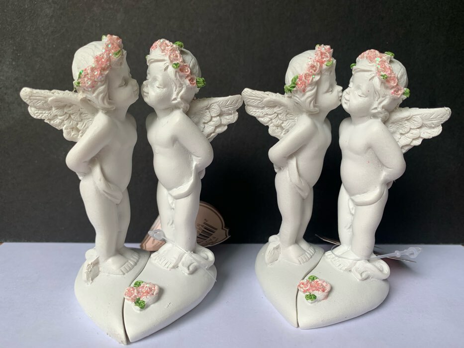 Фотография покупателя товара Сувенир полистоун "Целующиеся ангелочки в розовых веночках" набор из 2 штук 8,3х5х4,8 см