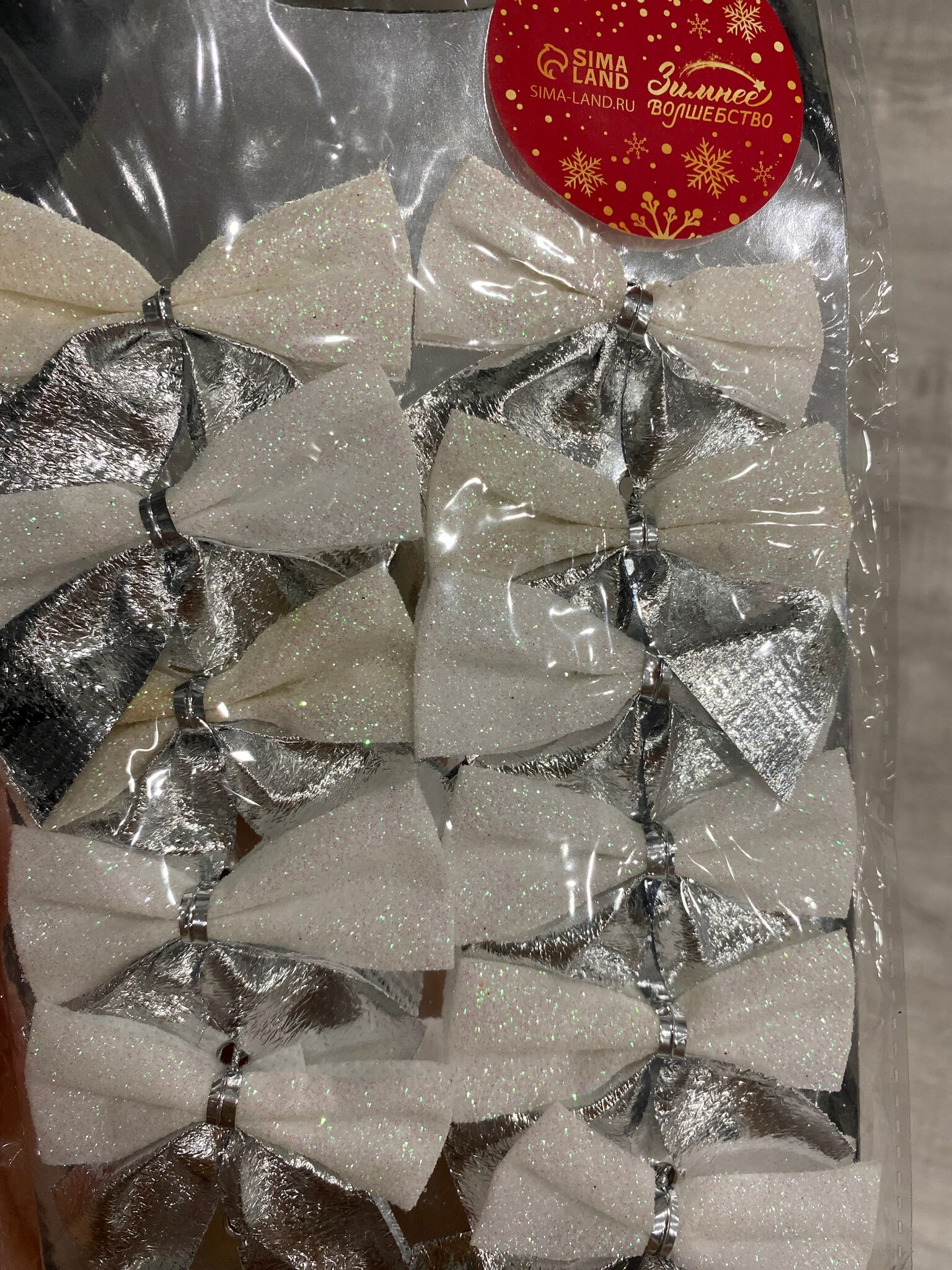Фотография покупателя товара Украшение ёлочное "Бант" (набор 12 шт) 5,5х5 см, серебристо-белый