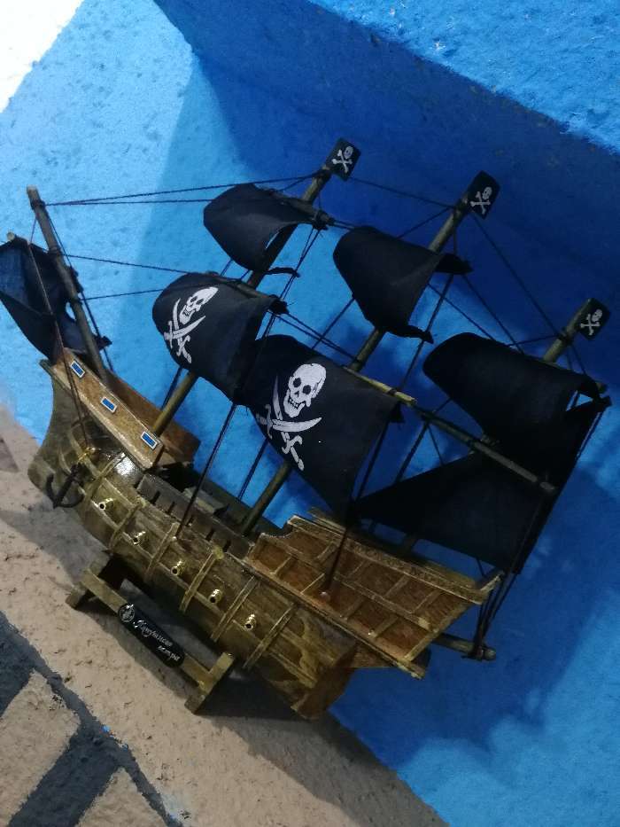 Фотография покупателя товара Корабль сувенирный средний «Каймон», светлое дерево, паруса чёрные пиратские, 33х8х29 см - Фото 3