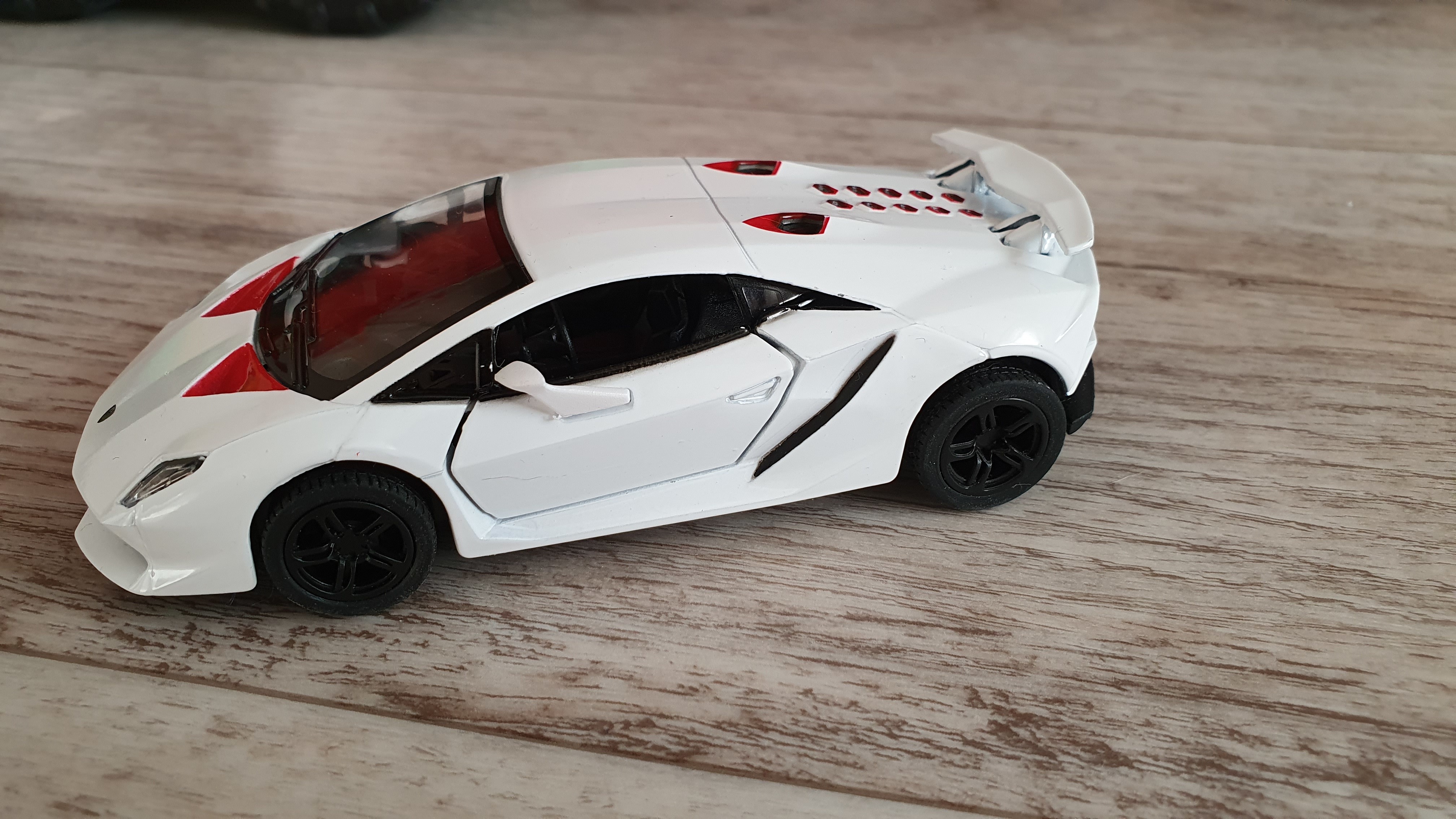 Фотография покупателя товара Машина металлическая Lamborghini Sesto Elemento, 1:38, открываются двери, инерция, цвет синий - Фото 2