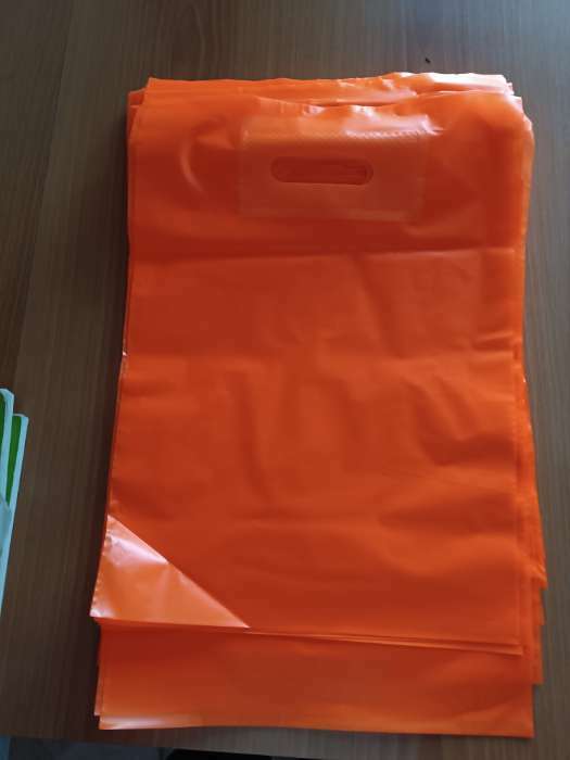 Фотография покупателя товара Пакет полиэтиленовый с вырубной усиленной ручкой, Кислотно - оранжевый 30 х 40 см, 50 мкм - Фото 2