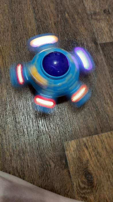 Фотография покупателя товара Развивающая игрушка «Морская звезда», двигается, вращается на 360 градусов, световые и звуковые эффекты, МИКС - Фото 3