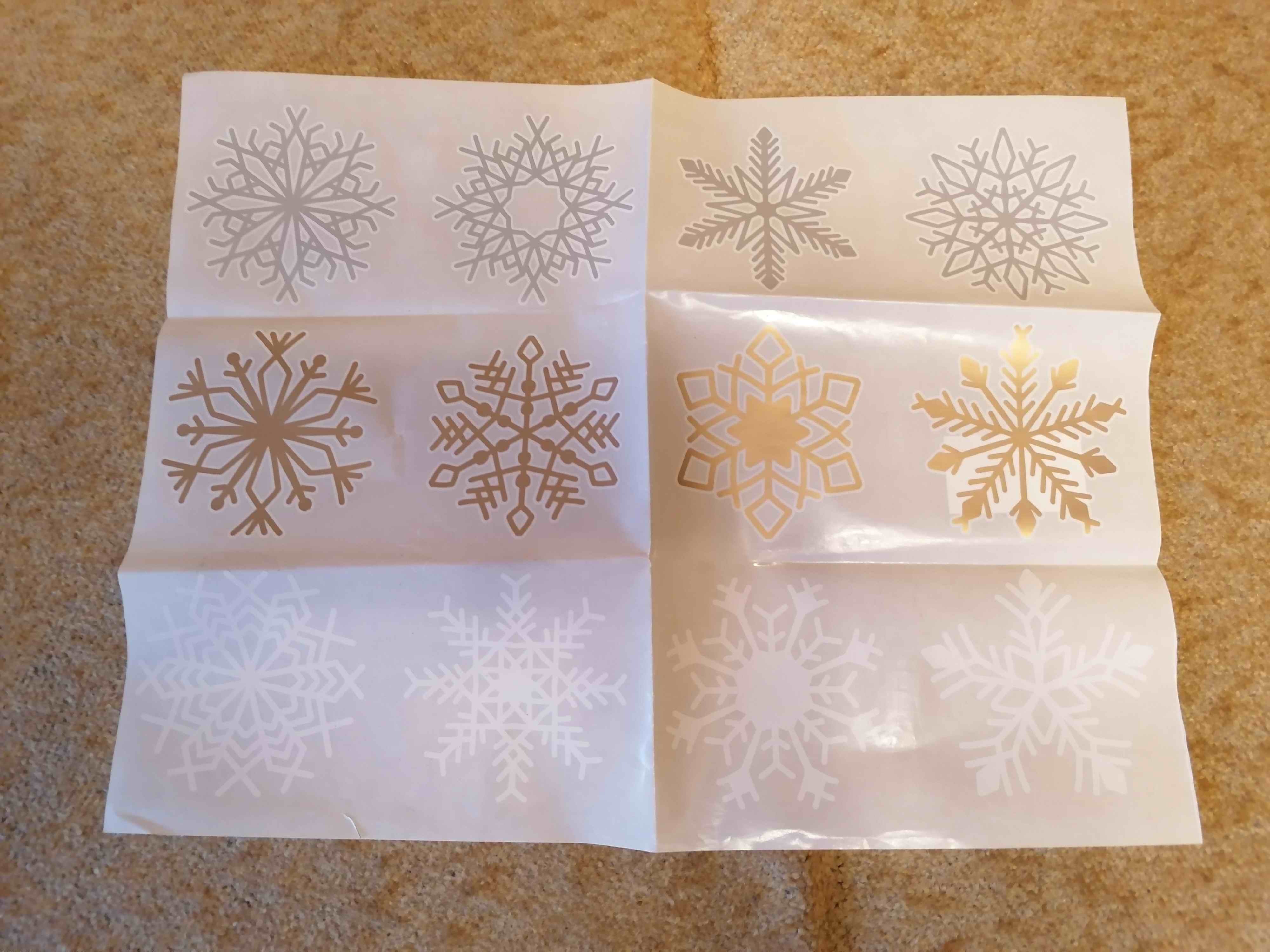 Фотография покупателя товара Набор наклеек новогодних "Снежинки" 12 шт в наборе, белые, золото, серебро, 9 x 9 см - Фото 2