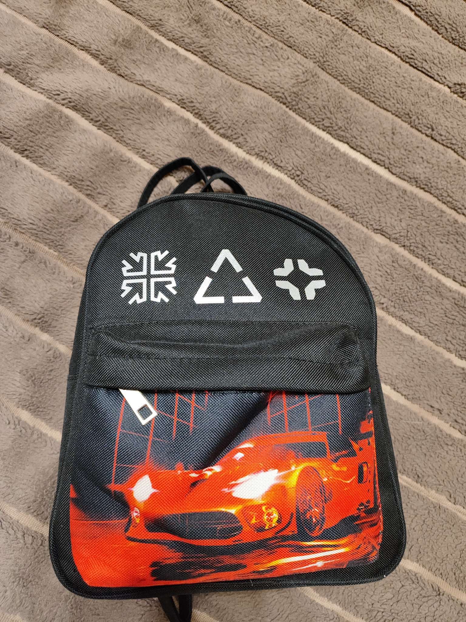 Фотография покупателя товара Рюкзак школьный текстильный c карманом «Машинка», светоотражающие элементы, 27×23×10 см - Фото 2