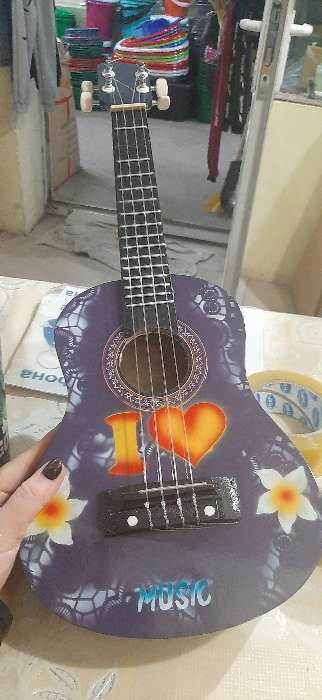 Фотография покупателя товара Музыкальный инструмент гитара-укулеле "Цветы" 55х20х6 см - Фото 2