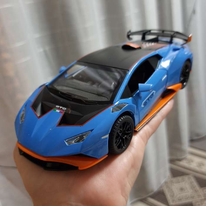 Фотография покупателя товара Машинка металлическая «Купе», 1:24, открываются двери, капот, багажник, инерция, цвет оранжевый - Фото 7