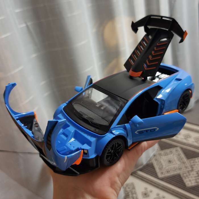 Фотография покупателя товара Машинка металлическая «Купе», 1:24, открываются двери, капот, багажник, инерция, цвет оранжевый - Фото 9