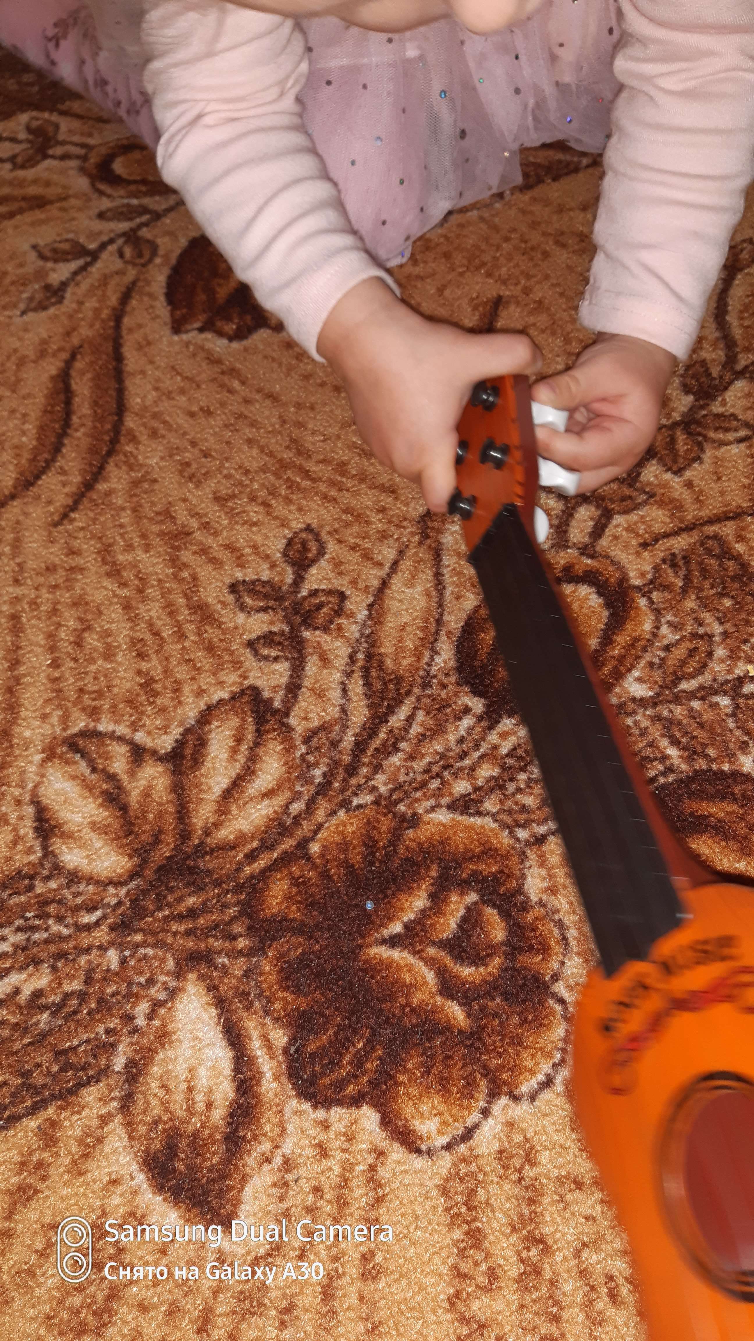 Фотография покупателя товара Детский музыкальный инструмент «Гитара: Классика», цвета МИКС - Фото 5
