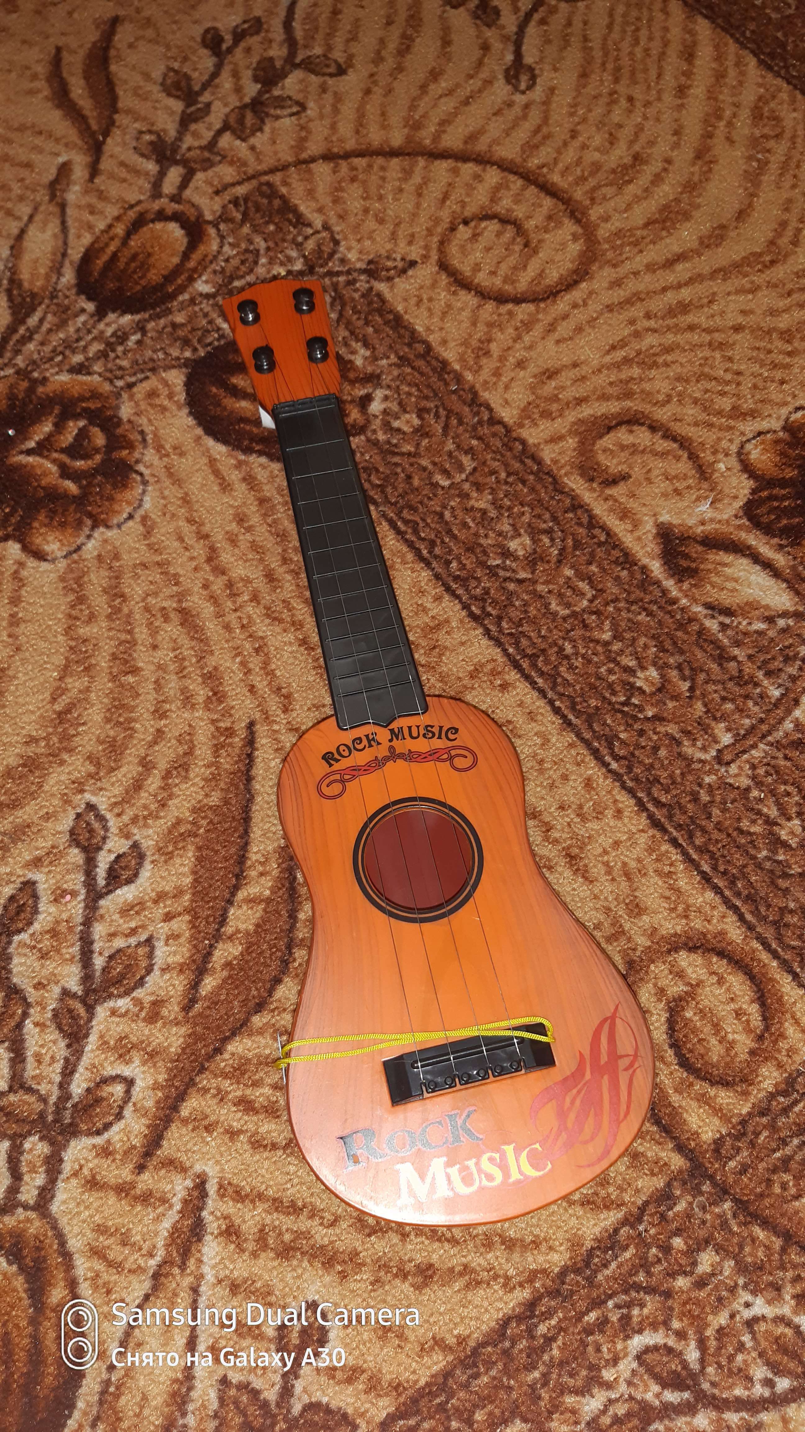 Фотография покупателя товара Детский музыкальный инструмент «Гитара: Классика», цвета МИКС - Фото 6