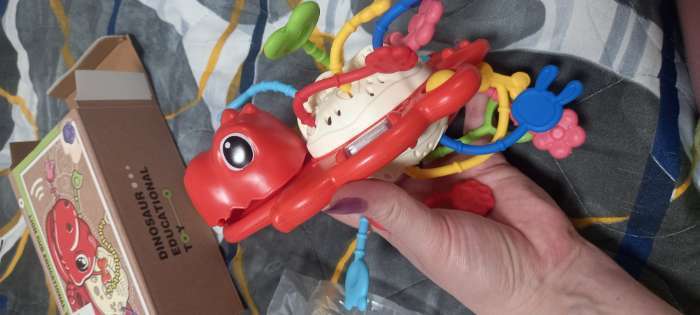 Фотография покупателя товара Развивающая игрушка «Динозаврик», цвет зелёный - Фото 3