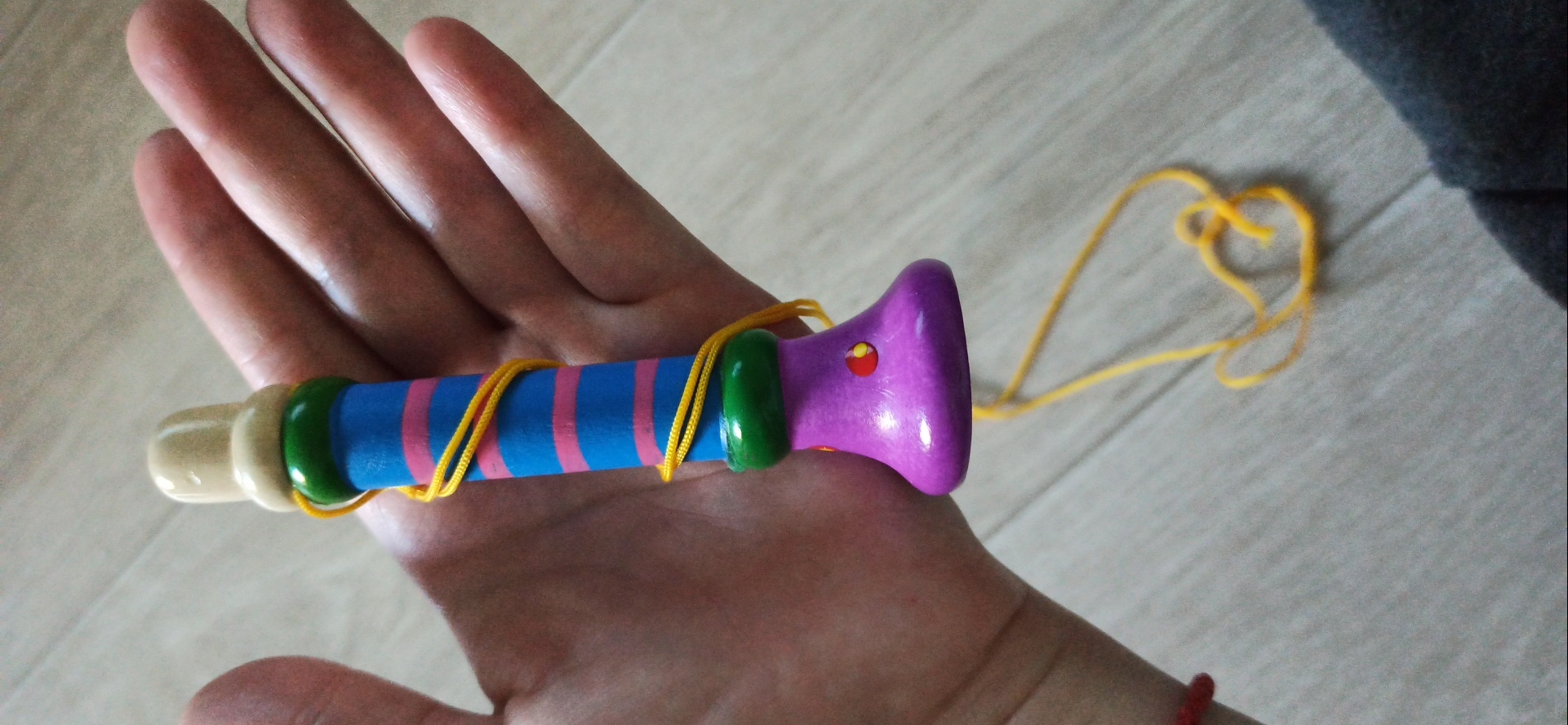 Фотография покупателя товара Музыкальная игрушка «Дудочка на веревочке», высокая, цвета МИКС - Фото 6
