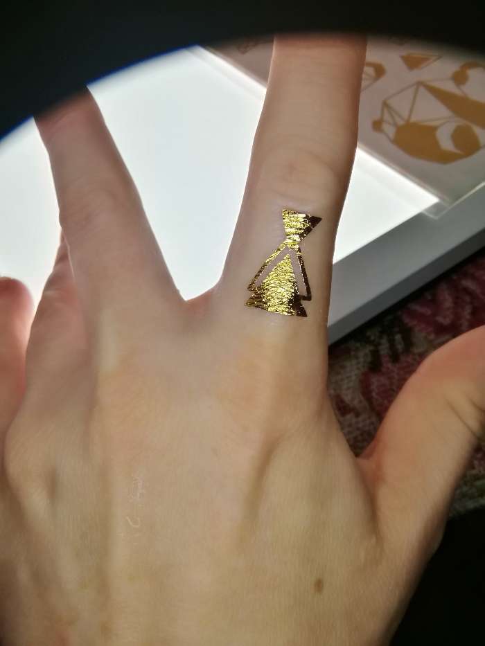 Фотография покупателя товара Детские татуировки-переводки, 10×15 см, набор 2 листа, золото, «Звярята, оригами» - Фото 1