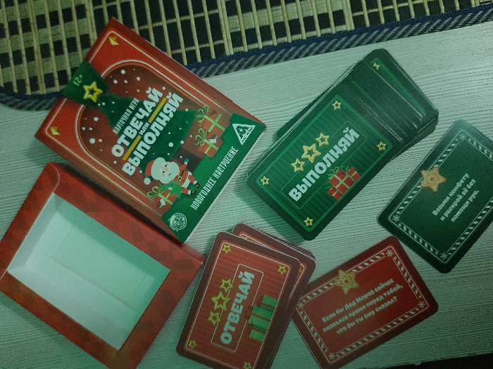 Фотография покупателя товара Новогодняя настольная игра «Новый год: Отвечай или выполняй», 50 карт, 12+ - Фото 7