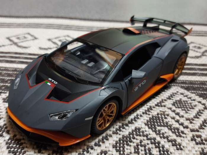 Фотография покупателя товара Машинка металлическая «Купе», 1:24, открываются двери, капот, багажник, инерция, цвет оранжевый - Фото 6