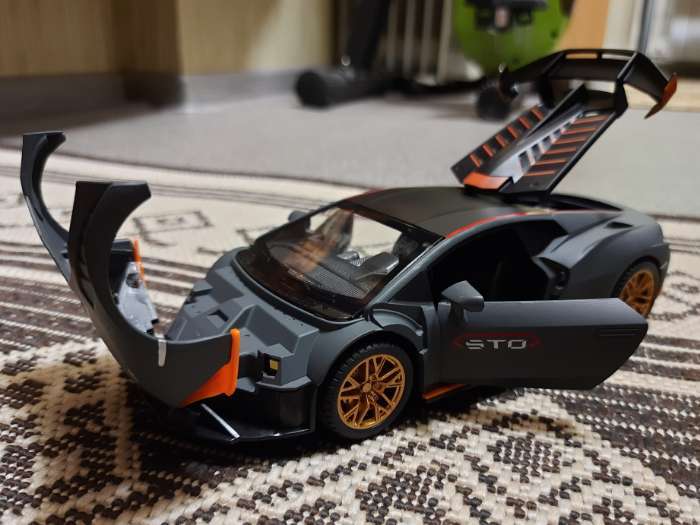 Фотография покупателя товара Машинка металлическая «Купе», 1:24, открываются двери, капот, багажник, инерция, цвет оранжевый - Фото 5