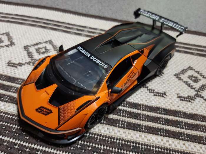 Фотография покупателя товара Машинка металлическая «Купе», 1:24, открываются двери, капот, багажник, инерция, цвет оранжевый - Фото 2