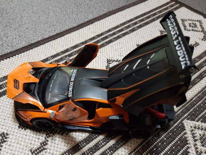 Фотография покупателя товара Машинка металлическая «Купе», 1:24, открываются двери, капот, багажник, инерция, цвет оранжевый - Фото 3