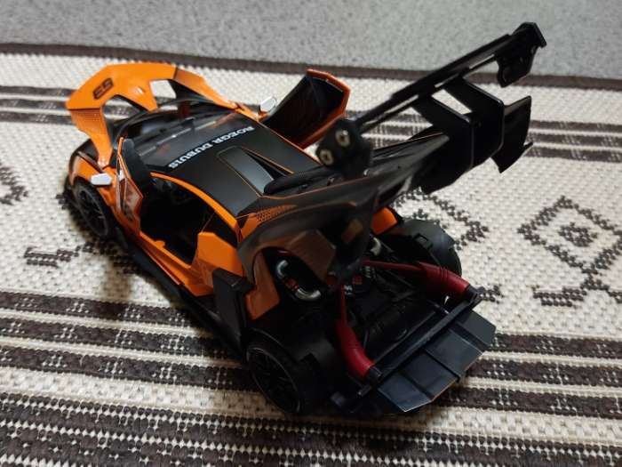 Фотография покупателя товара Машинка металлическая «Купе», 1:24, открываются двери, капот, багажник, инерция, цвет оранжевый - Фото 4