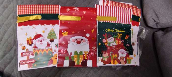 Фотография покупателя товара Пакет полиэтиленовый подарочный новогодний, с завязками «Подарки» МИКС, 15×23 см - Фото 1