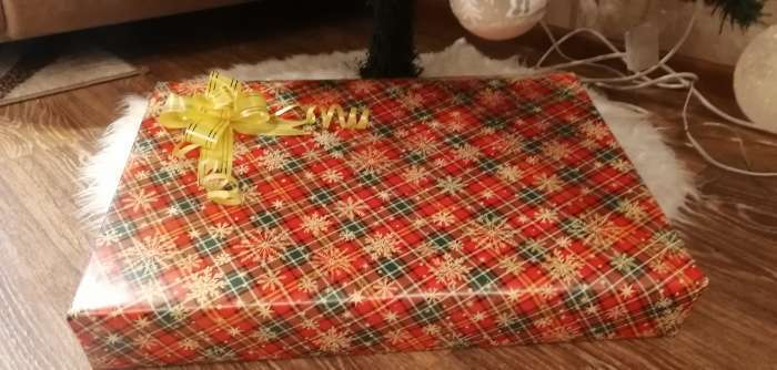 Фотография покупателя товара Бумага упаковочная глянцевая «Новогодний принт», 70 х 100 см, Новый год - Фото 2