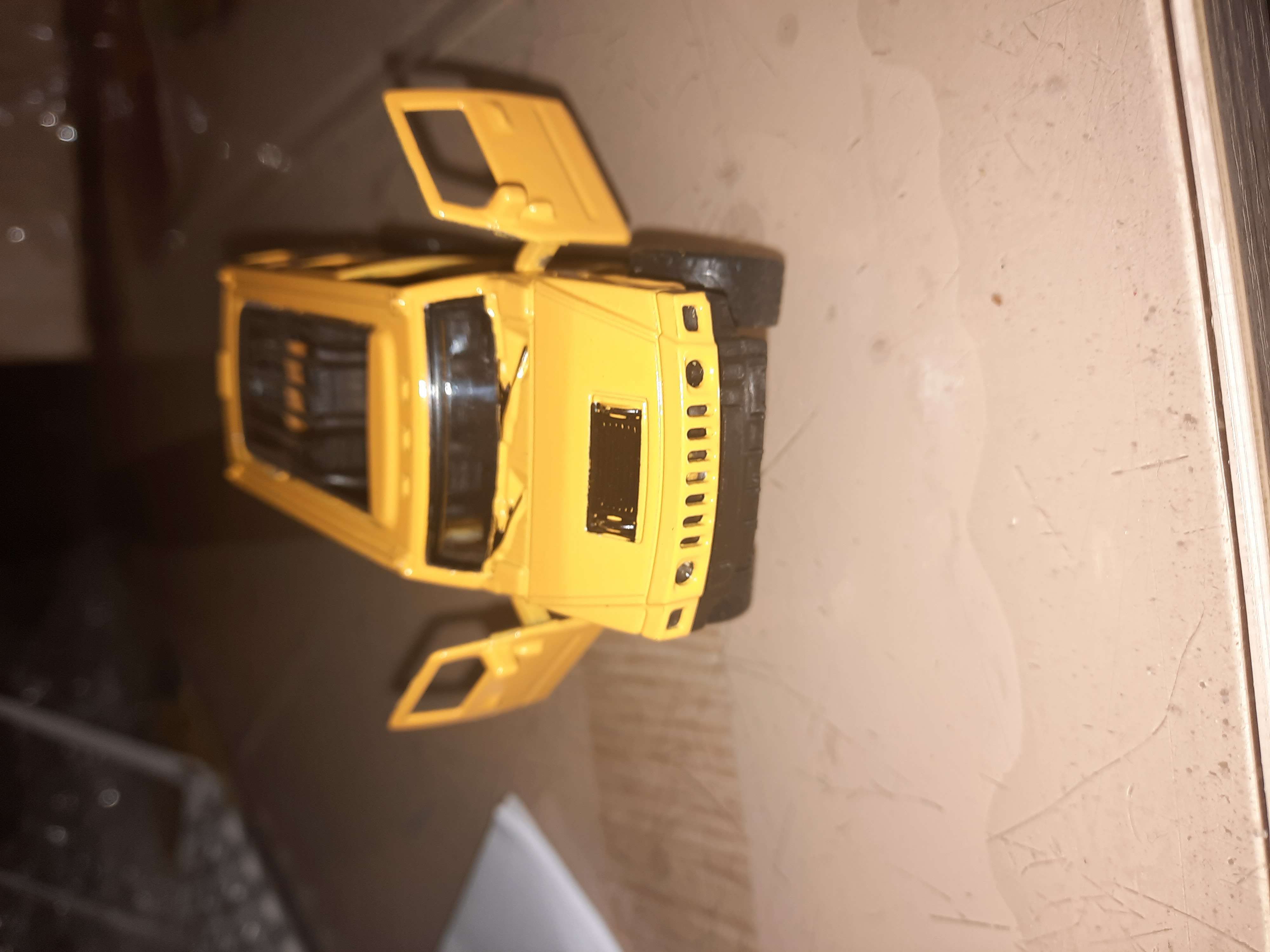 Фотография покупателя товара Машина металлическая «Крузер», 1:48, инерция, открываются двери, цвет жёлтый